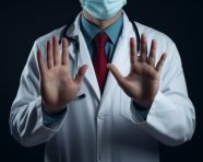 Doctor gesture of hands showing stopping the sign and a stethoscope, health and medical stock image