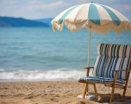 Umbrella and chair with pillow around beautiful landscape of beach and sea, beaches stock images for travel websites