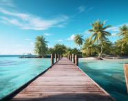A wooden pier leading onto a tropical island with palm trees, beaches stock images for travel websites