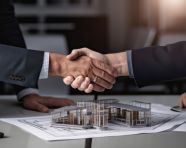 Image shows two architects shaking hands as they close a deal, home loan stock image