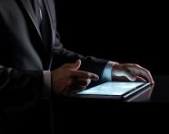 A man points at a tablet computer, seo stock images for marketing campaigns