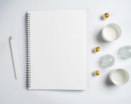 A white notebook with some graphs on the white background top view stock photo, seo stock images for marketing campaigns