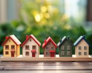 Hand holding a house new offers in the real estate market, home loan stock image