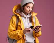 Young woman checking travel app on phone, adventure travel stock images, adventure travel ai prompts, travel stock images ai