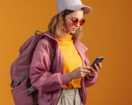 Traveler checking email on phone, adventure travel stock images, adventure travel ai prompts, travel stock images ai