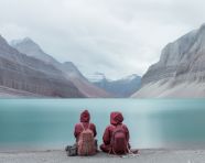 Two friends bonding over a beautiful lake, adventure travel stock images, adventure travel ai prompts, travel stock images ai