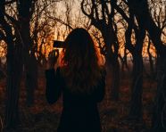 Girl taking pictures of trees, adventure travel stock images, adventure travel ai prompts, travel stock images ai