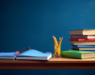 School desk with books on blue background, back to school stock images ai, back to school stock illustrations ai, back to school ai prompts