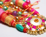 A white rakhi made of colourful cloths and beads stock photo