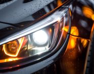 Car headlights in the distance, assembly line car production, assembly line car manufacturing