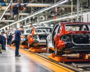 Assembly line workers building cars, assembly line car production, assembly line car manufacturing