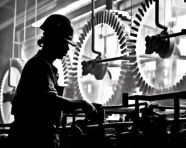 Worker in the shadows of industry, industrial machinery stock images ai, midjourney prompt ideas