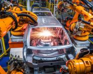 Assembly line workers and robots, industrial machinery stock images ai, midjourney prompt ideas