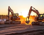 Tractors and excavators at a construction site, industrial machinery stock images ai, midjourney prompt ideas