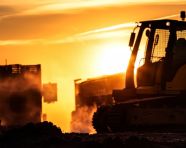Construction worker on the job at dusk, industrial machinery stock images ai, midjourney prompt ideas