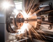 A cnc turning machine is cutting a metal workpiece, industrial machinery stock images ai, midjourney prompt ideas