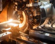 A cnc turning machine is seen from above the machine is cutting a metal workpiece the cutting tool, industrial machinery stock images ai, midjourney prompt ideas