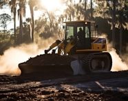Bulldozer pushing a pile of dirt, industrial machinery stock images ai, midjourney prompt ideas