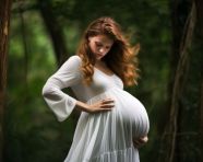 Pregnant woman in flowing white dress, pregnant women pictures, maternity photos