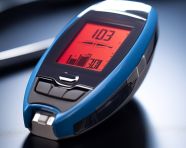 Man checking blood sugar with glucose meter, diabetes concept