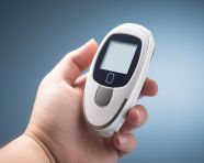 Diabetic checking blood sugar with glucometer, diabetes concept