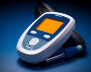 Blue and white glucometer with digital display, diabetes concept