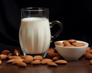 Almond milk in a glass with a splash, almond image