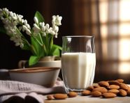 A glass of almond milk with almonds, almond image