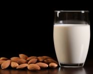 One glass of almond milk in white ware, almond image