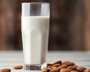 Almond milk on a table seen from afar, almond image