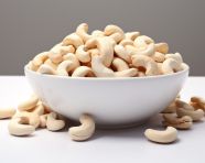 A bowl of whole cashews, cashew image