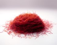 Pile of saffron seeds on white, saffron flower image