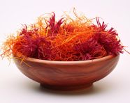 Saffron seeds in contrasting white, saffron flower image