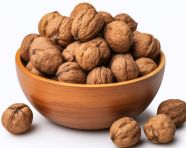 Walnuts in a bowl on a white background, walnuts image