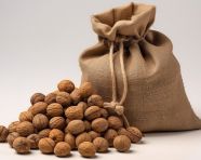 Walnuts in a bag with holes and nuts, walnuts image