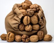 Walnuts in a sack on a white background, walnuts image