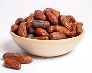 Pile of dried dates on white background, sweet dates image