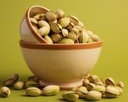 A bowl filled with pistachio, pistachio nut image