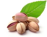 Pistachio nuts with green leaves isolated on white, pistachio nut image