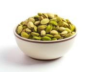 A bowl of pistachios is arranged on a white background, pistachio nut image