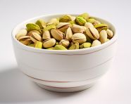 Pistachios in a white bowl, pistachio nut image
