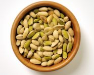 Full bowl of pistachios with white background, pistachio nut image