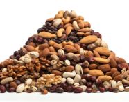 A pile of nuts on a white background, dry fruits mix image
