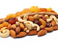 Variety of dried fruits and nuts on white, dry fruits mix image