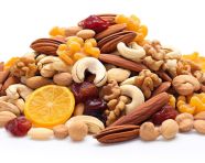 Healthy snack of dried fruits and nuts on white, dry fruits mix image