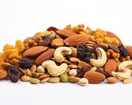 Heap of dried fruits and nuts on white, dry fruits mix image