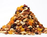 Pile of dried fruits and nuts on white background, dry fruits mix image