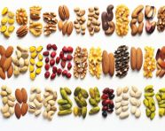 Different types of nuts with different colors on white background, dry fruits mix image