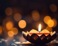 A close-up of a diya the flame flickering in the darkness, diwali festival stock image, diwali festival ai prompt