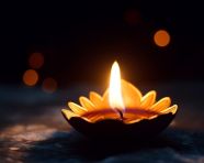 Diya flame flickering in the darkness, diwali festival stock image, diwali festival ai prompt